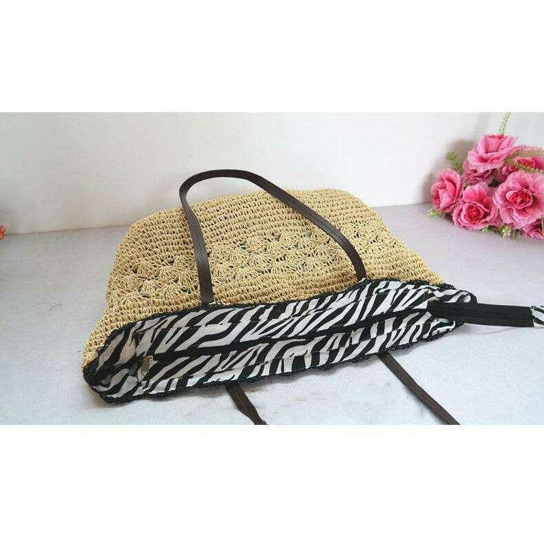 תיק קש בעבודת יד עם רצועות כתף ורקמת תחרה