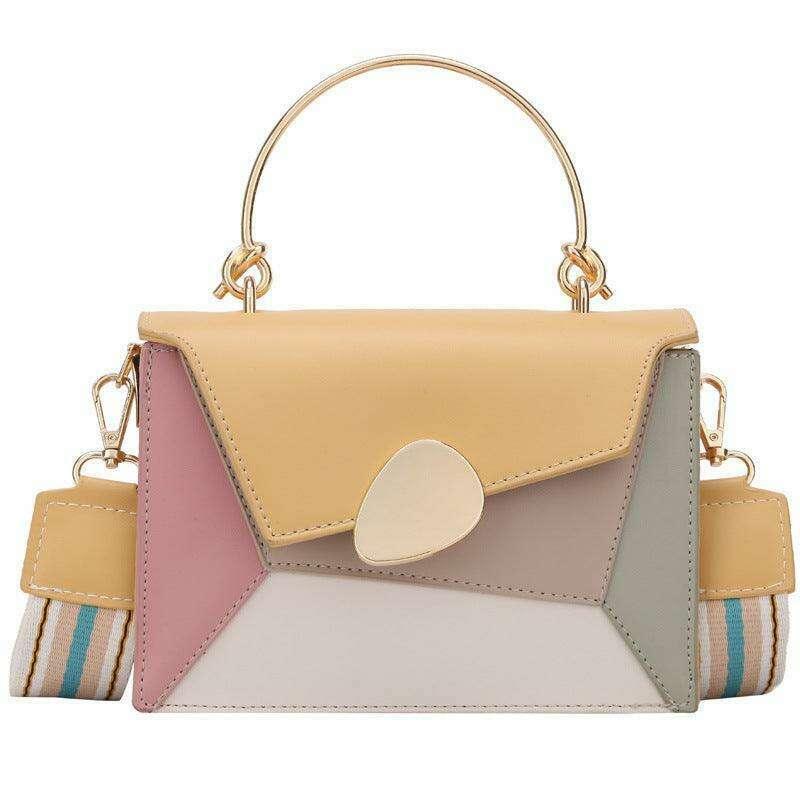 A bag designed in soft tones with a shoulder strap and an elegant carrying handle.