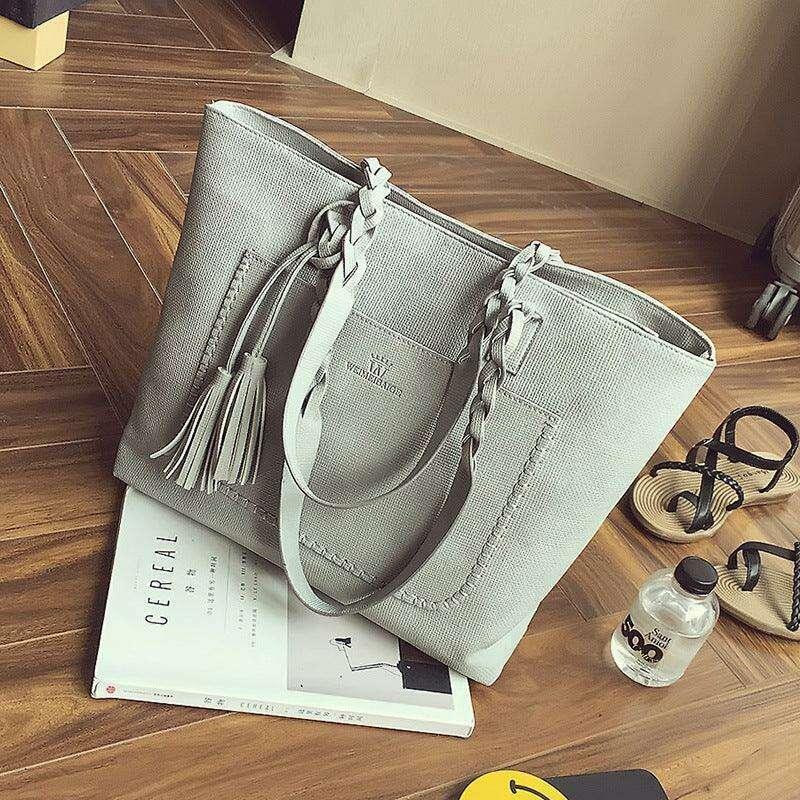 Fashionable tote bag with braided and tassel decoration