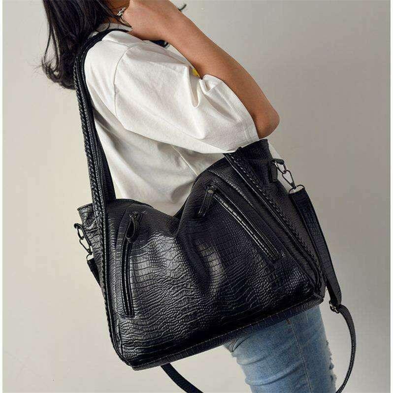 Women's side bag in black crocodile leather look