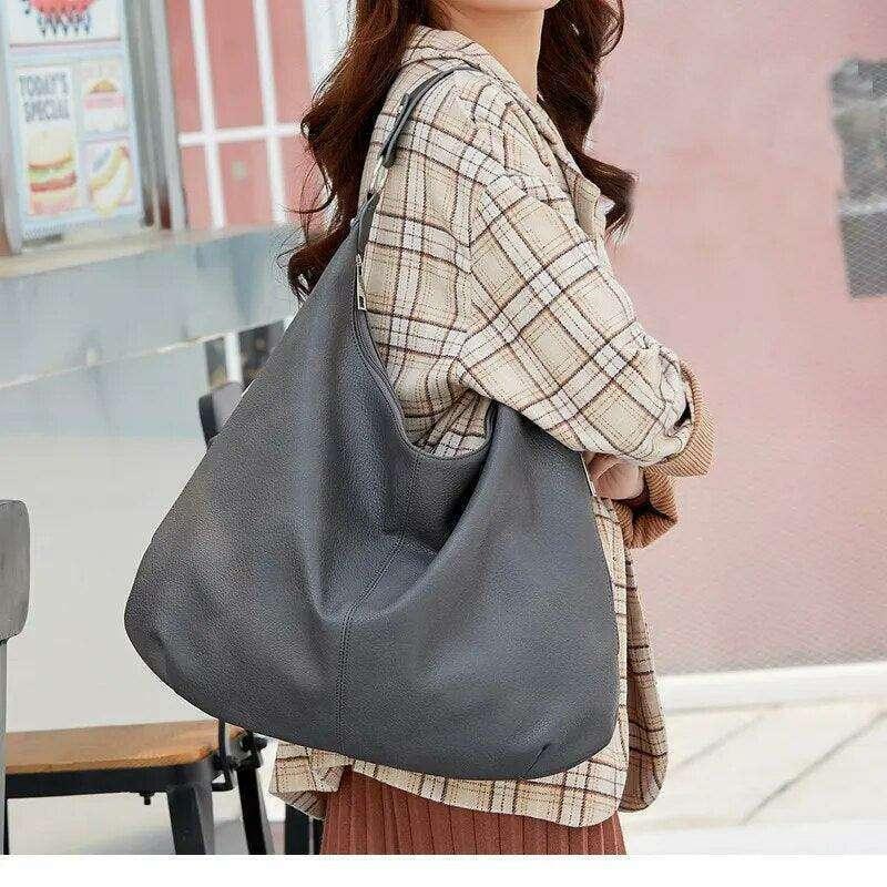 תיק כתף רחב מעור לנשים