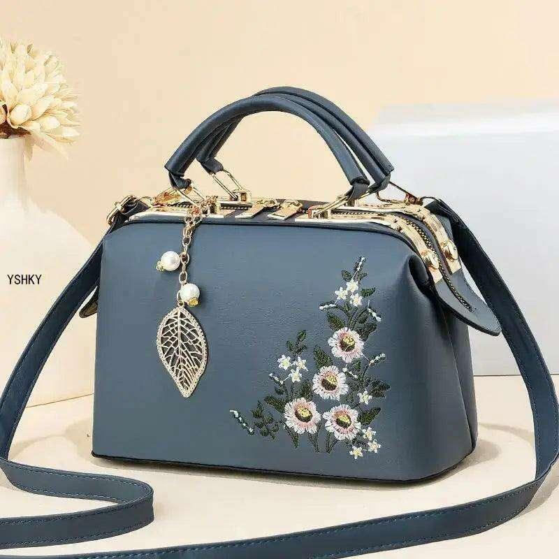 Elegant feminine bag with embroidered floral design