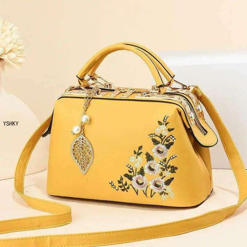 Elegant feminine bag with embroidered floral design