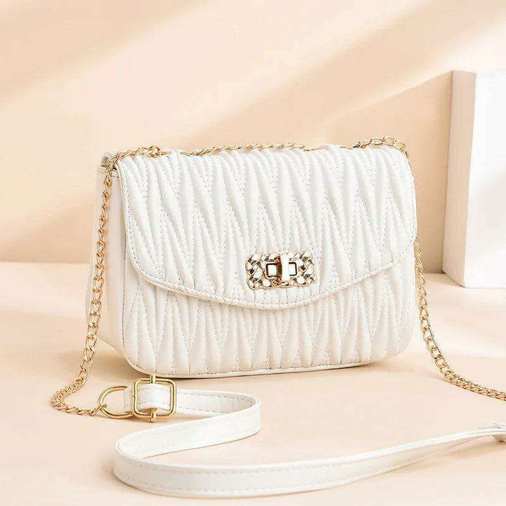 Women's side bag in a luxurious design with a gold chain