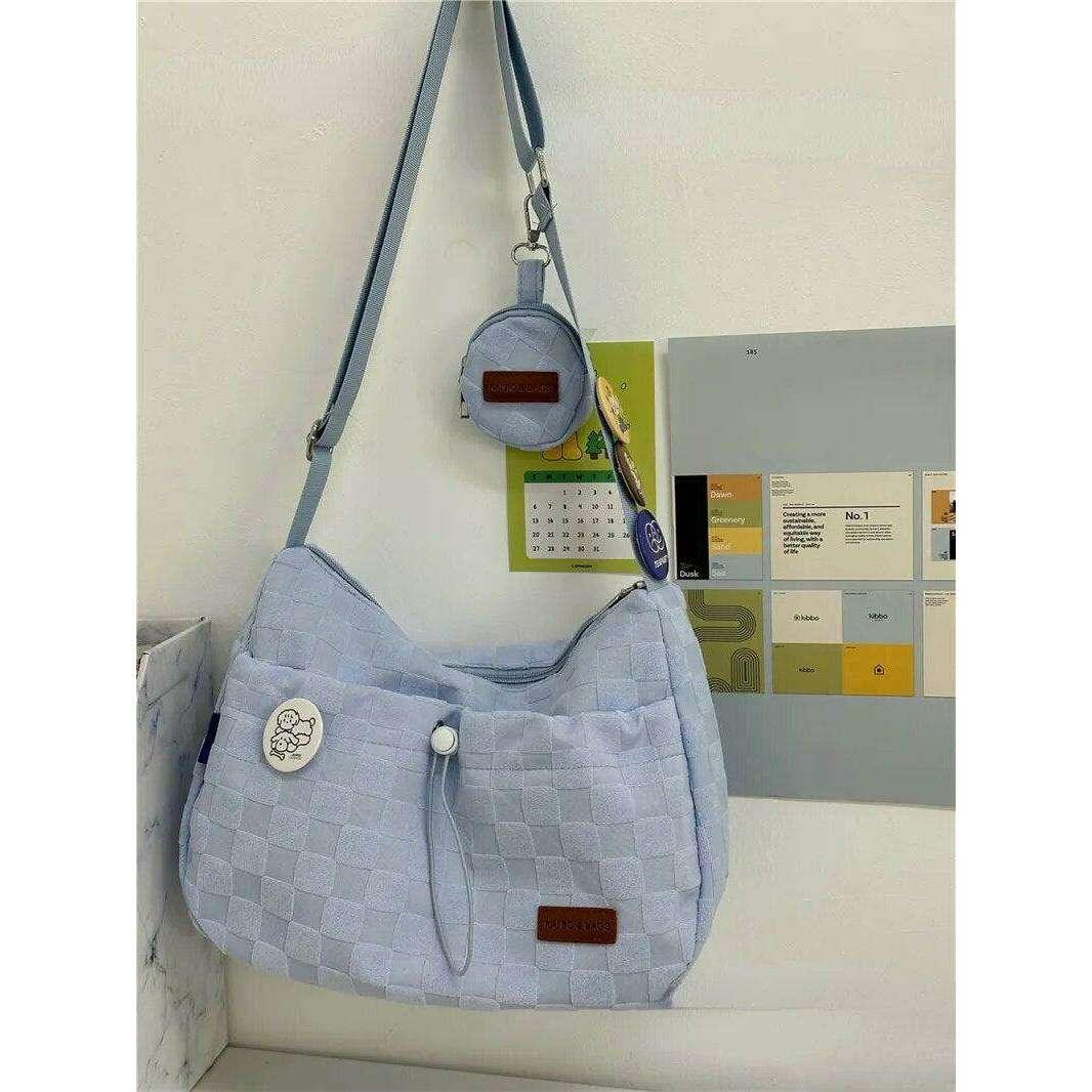 A padded fabric side bag in a modern design with cute details