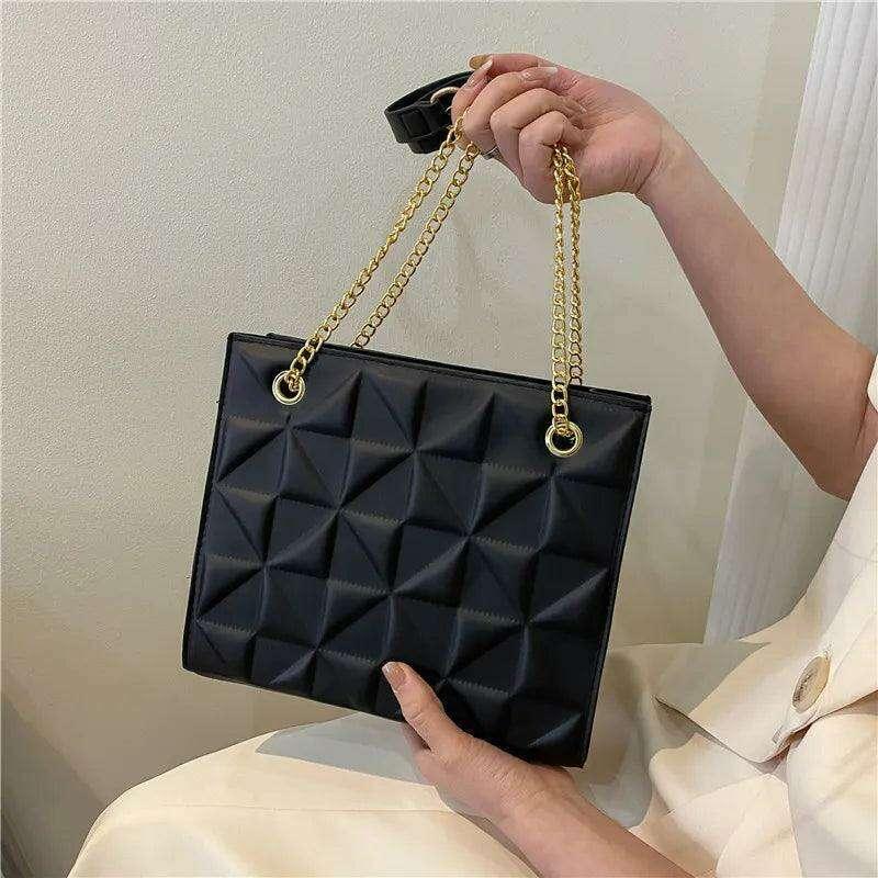 A designer crossbody bag for women with golden chain straps