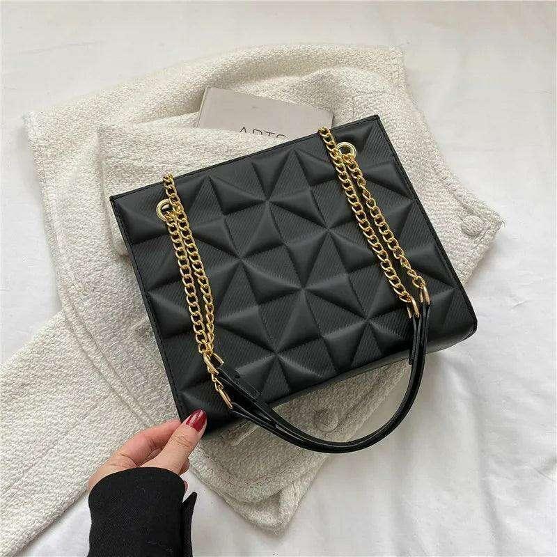 A designer crossbody bag for women with golden chain straps