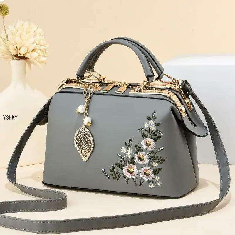 Elegant feminine bag with embroidered floral design