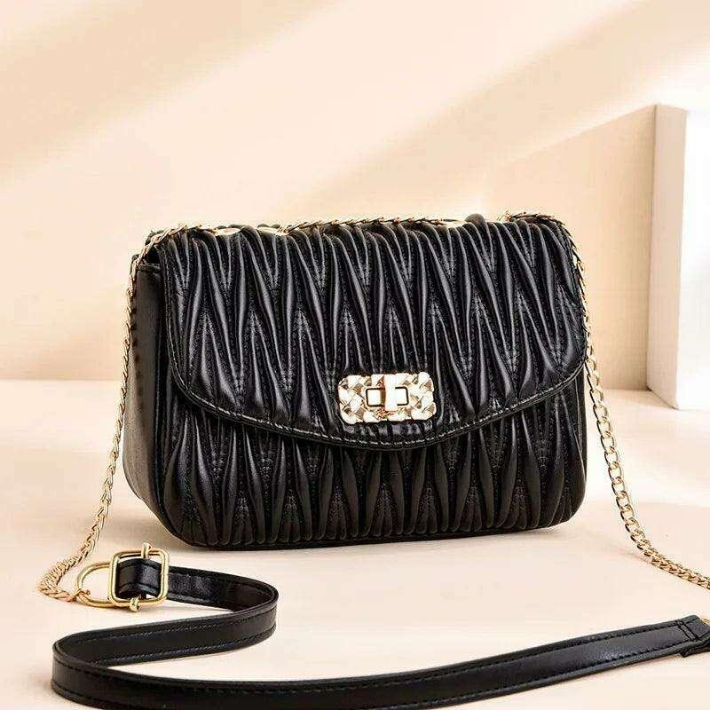 Women's side bag in a luxurious design with a gold chain