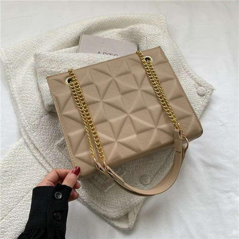 A designer crossbody bag for women with golden chain straps