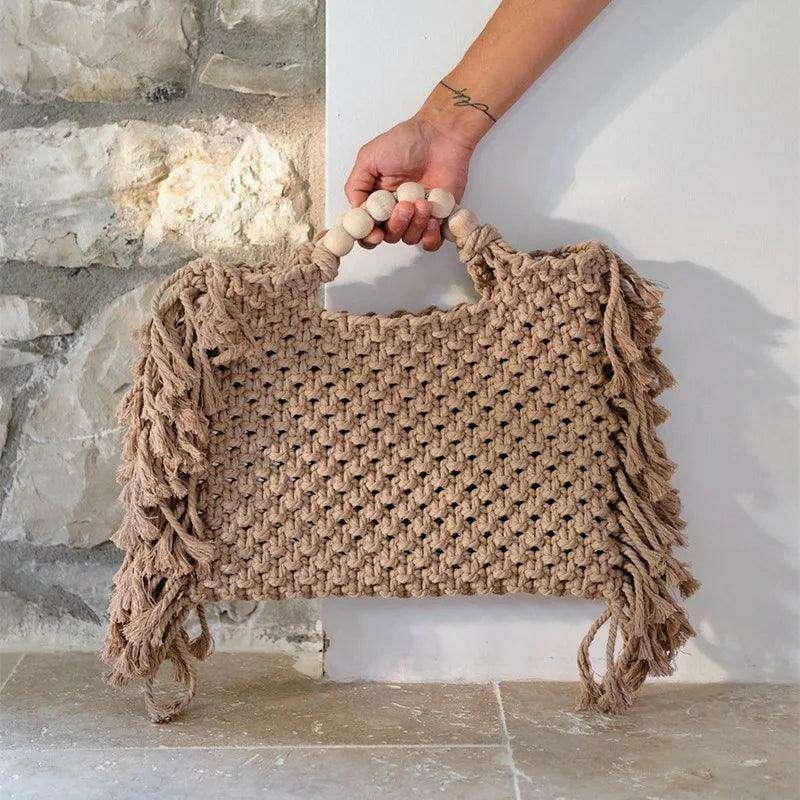 Knitted bag with wooden handles and bohemian touches