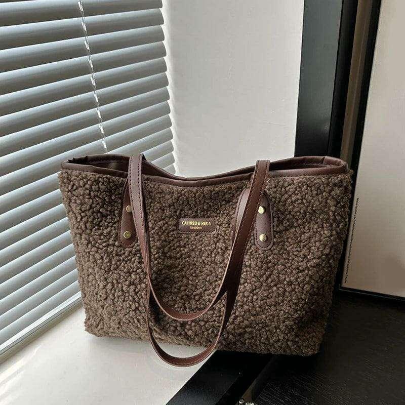 Women's brass shoulder bag - warmth and style for the winter season