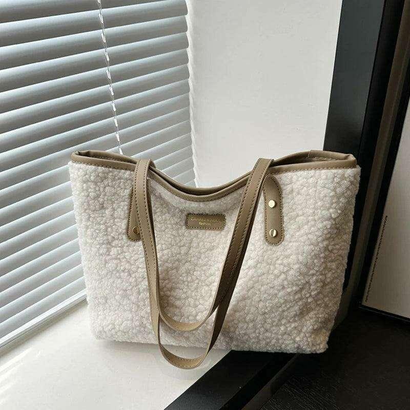 Women's brass shoulder bag - warmth and style for the winter season