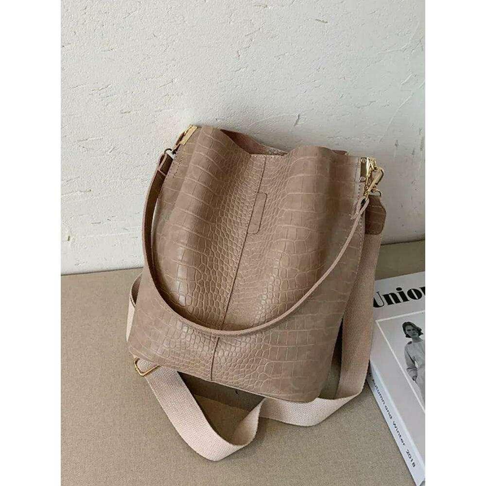 A fashionable shoulder bag with a unique look and crocodile texture