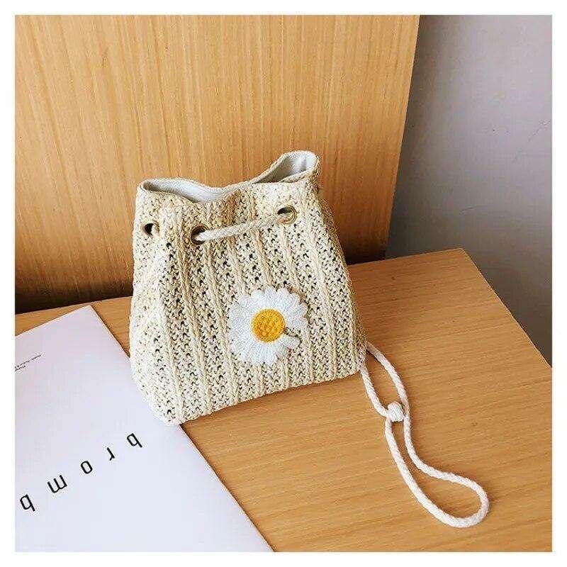 Women's knitted sack bag with floral decoration