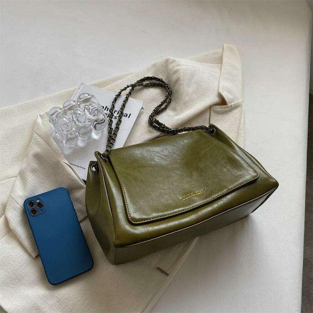 Women's crossbody bag with a designed chain strap