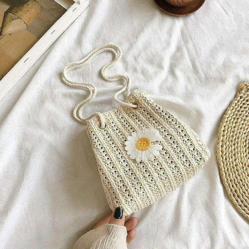 Women's knitted sack bag with floral decoration