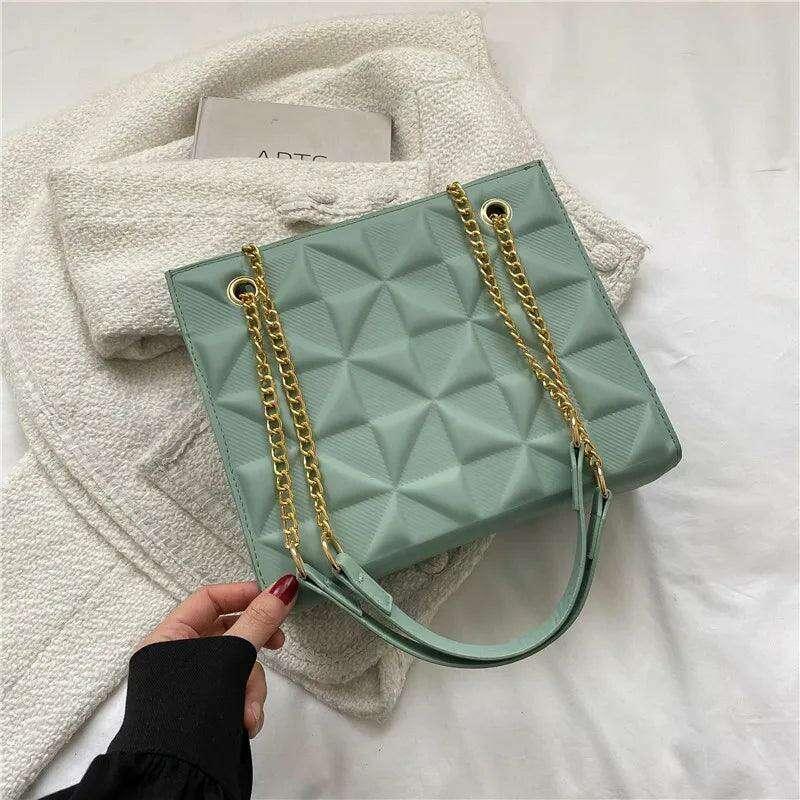 A designer crossbody bag for women with golden chain straps