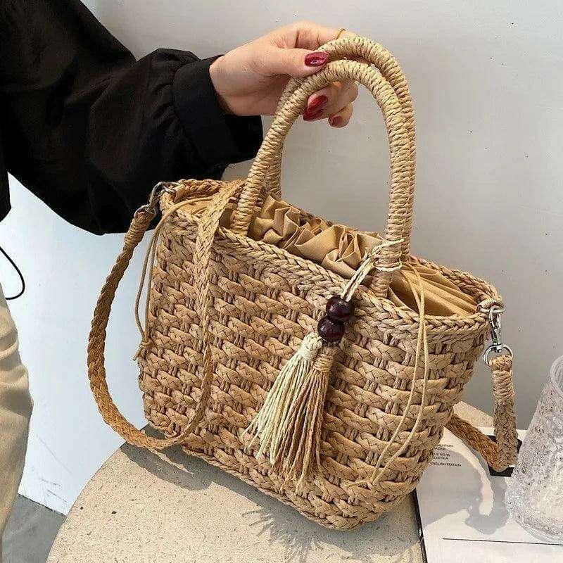 Small straw bag in a bohemian design with fringes