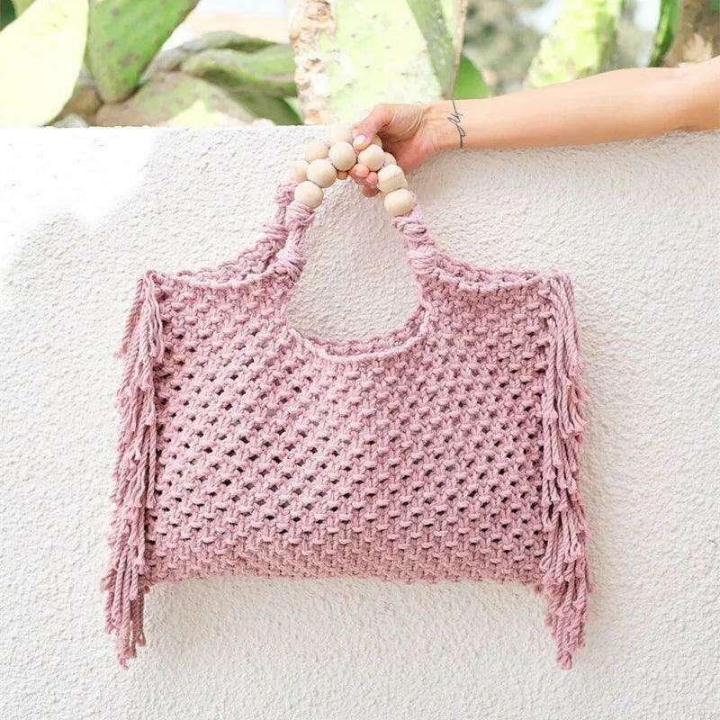 Knitted bag with wooden handles and bohemian touches