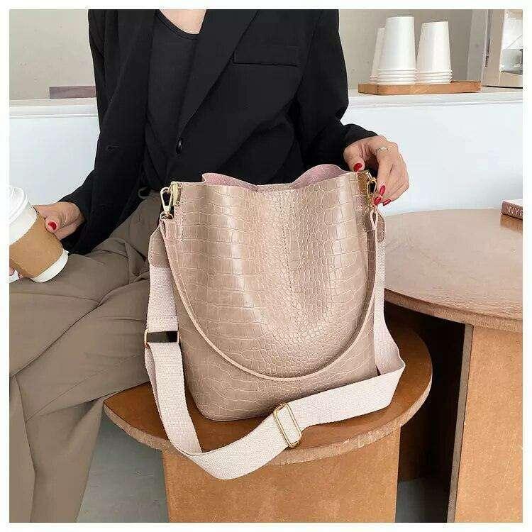 A fashionable shoulder bag with a unique look and crocodile texture