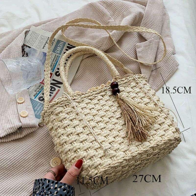 Small straw bag in a bohemian design with fringes