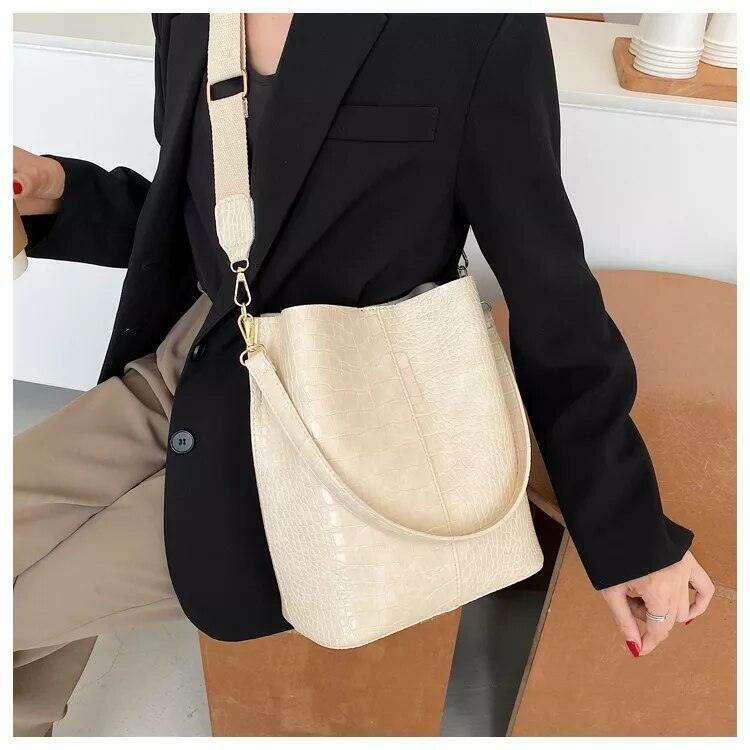 A fashionable shoulder bag with a unique look and crocodile texture