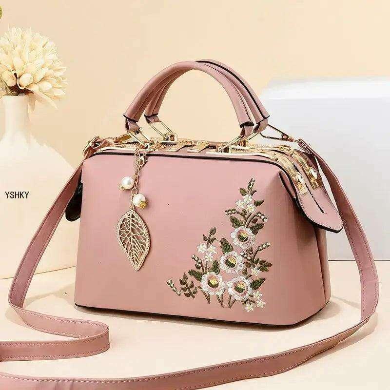 Elegant feminine bag with embroidered floral design