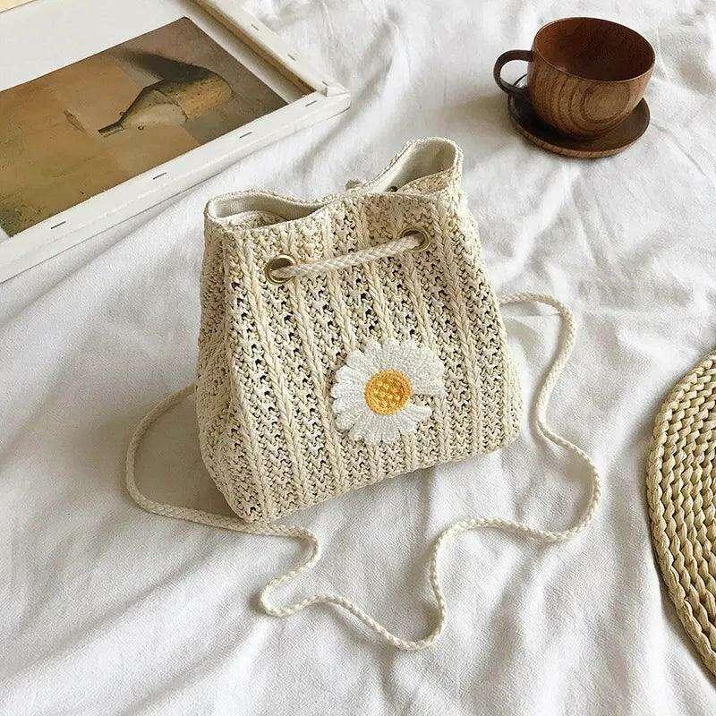 Women's knitted sack bag with floral decoration