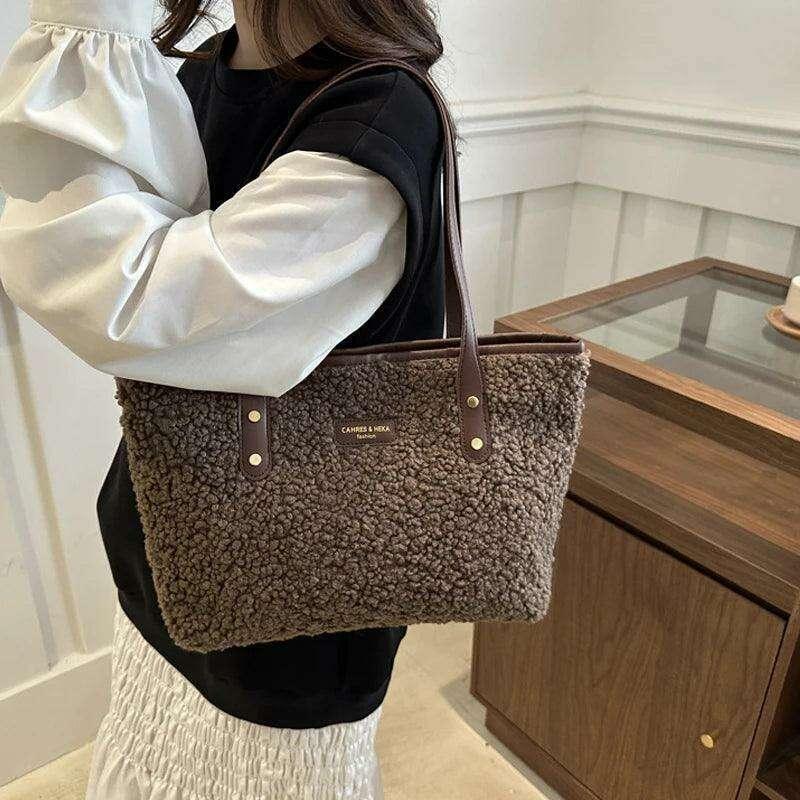 Women's brass shoulder bag - warmth and style for the winter season