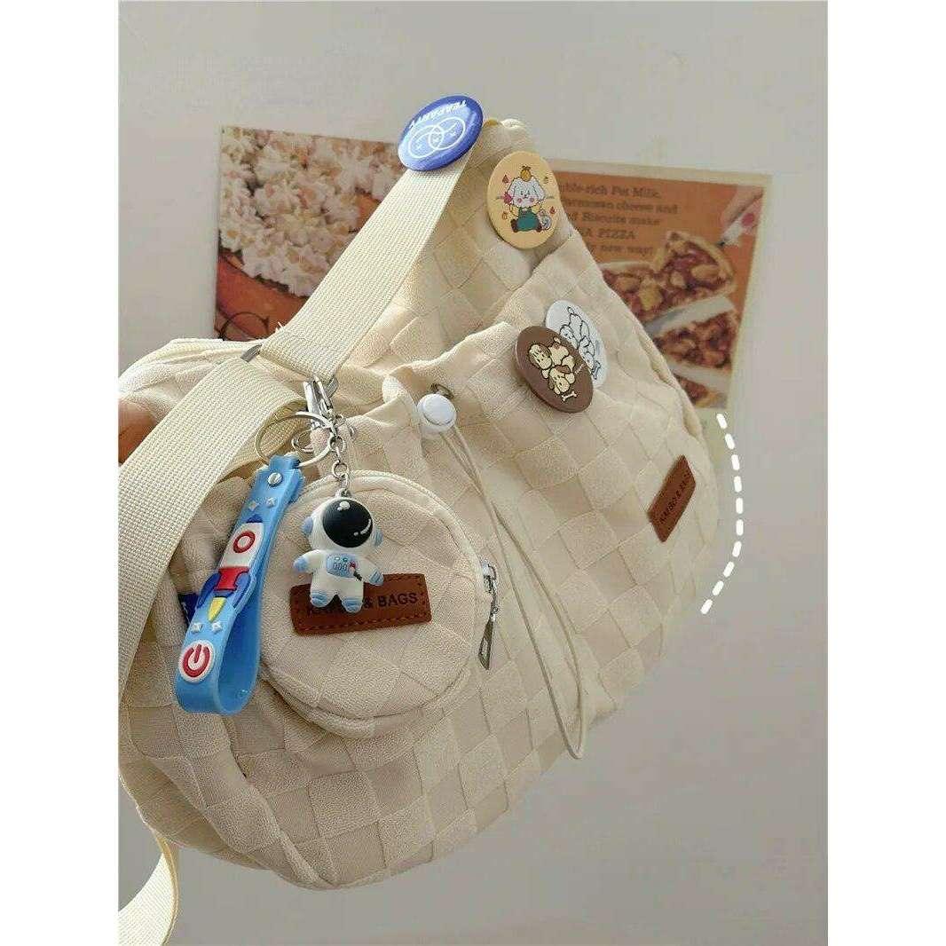 A padded fabric side bag in a modern design with cute details