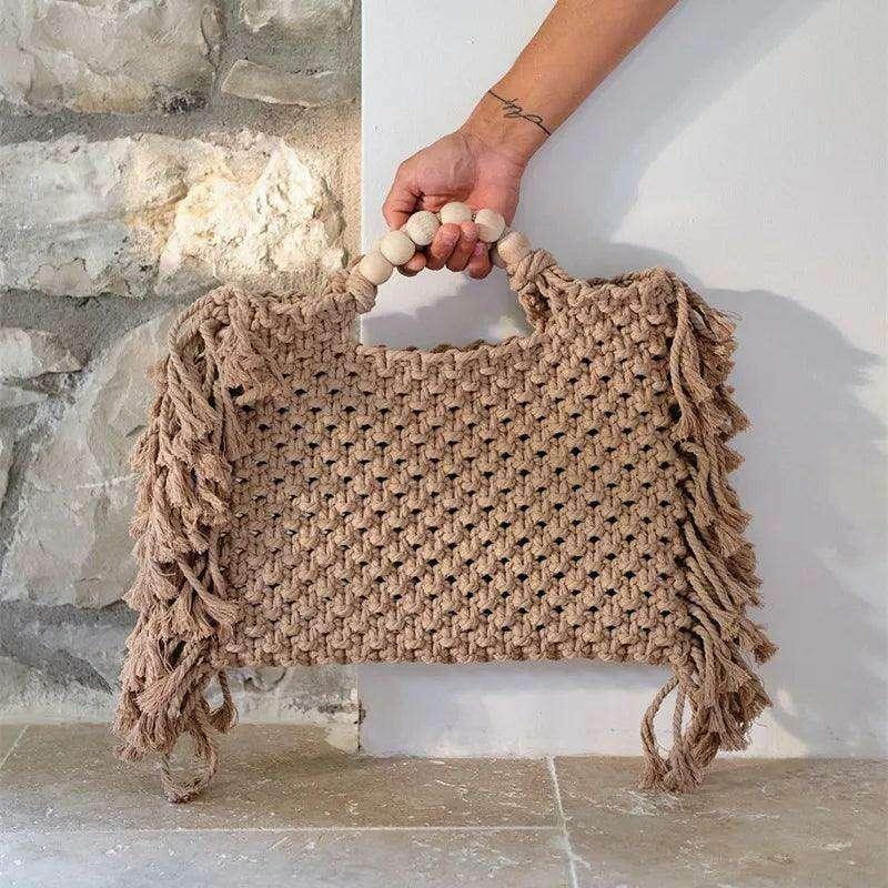 Knitted bag with wooden handles and bohemian touches