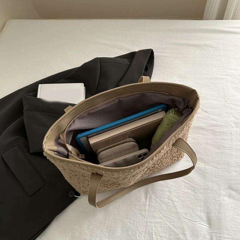 Women's brass shoulder bag - warmth and style for the winter season