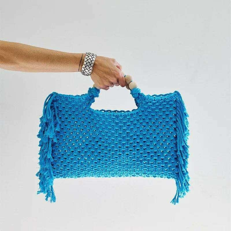 Knitted bag with wooden handles and bohemian touches