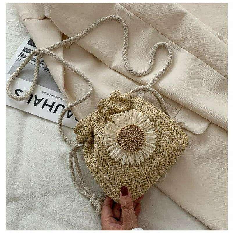 Knitted drawstring bag with daisy flower