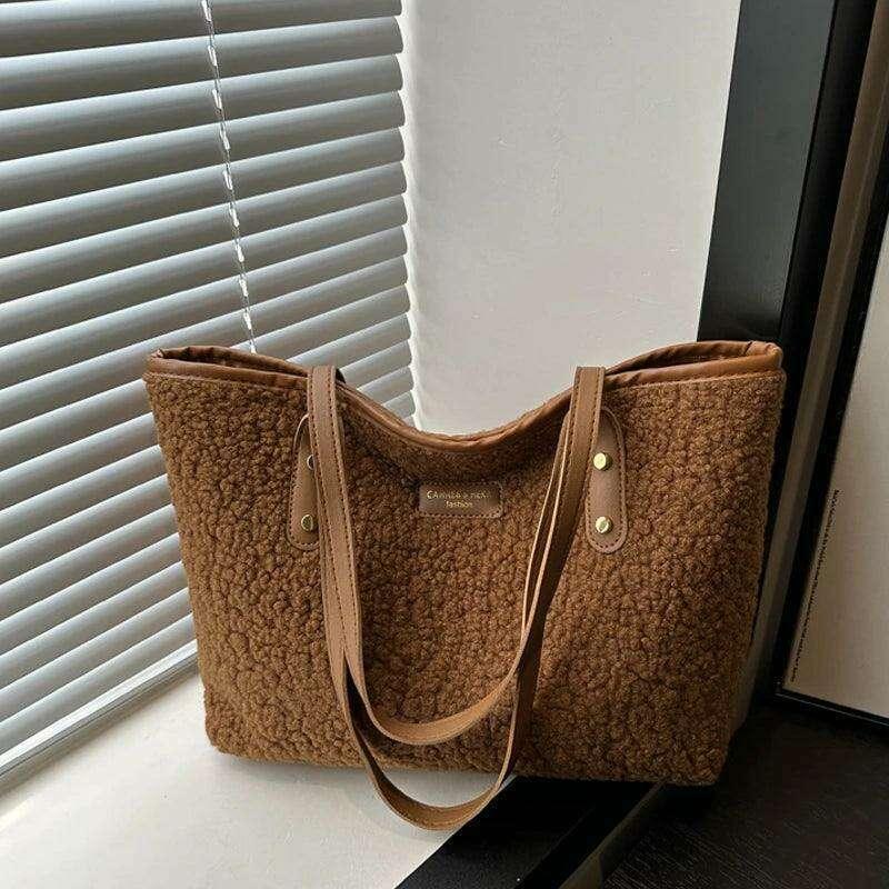 Women's brass shoulder bag - warmth and style for the winter season