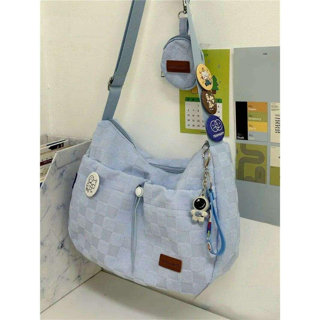 A padded fabric side bag in a modern design with cute details