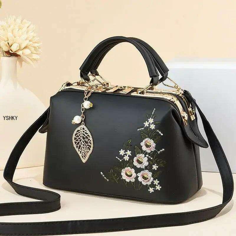 Elegant feminine bag with embroidered floral design