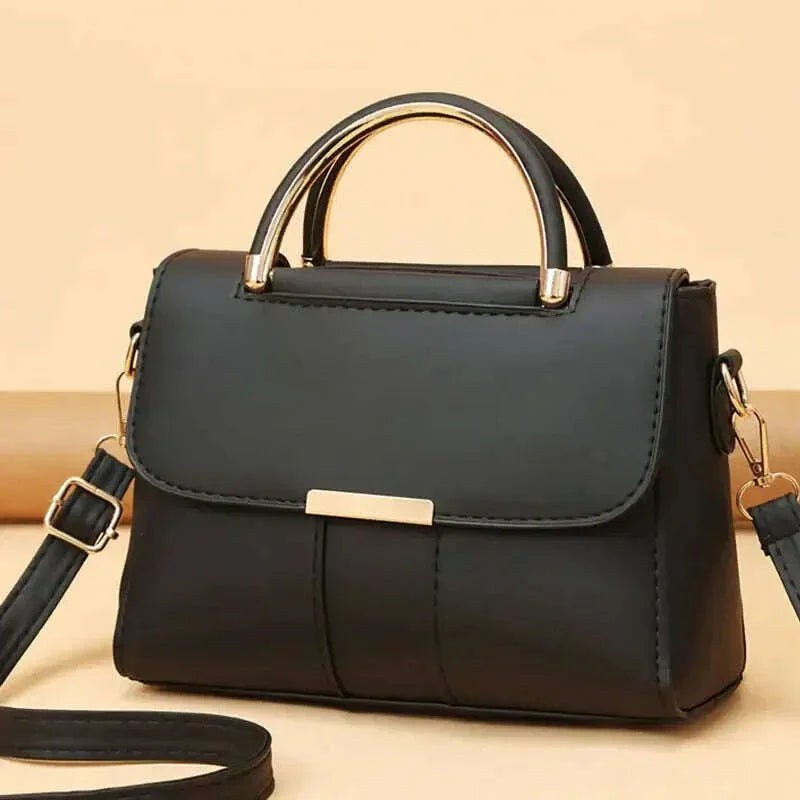 Elegant women's handbag with metal handle