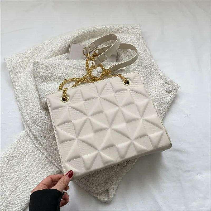 A designer crossbody bag for women with golden chain straps