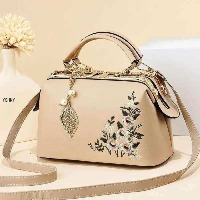 Elegant feminine bag with embroidered floral design