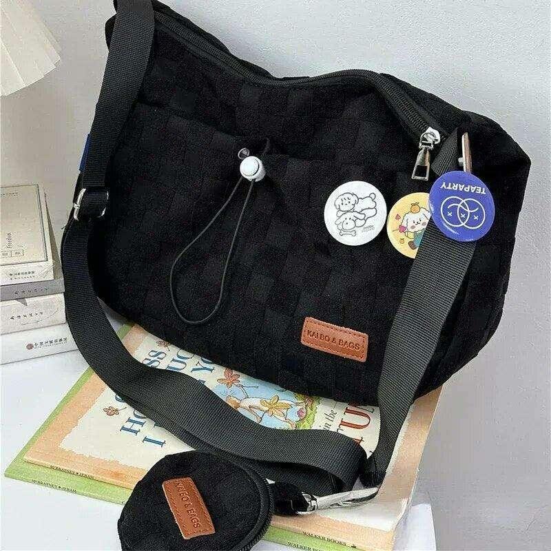 A padded fabric side bag in a modern design with cute details