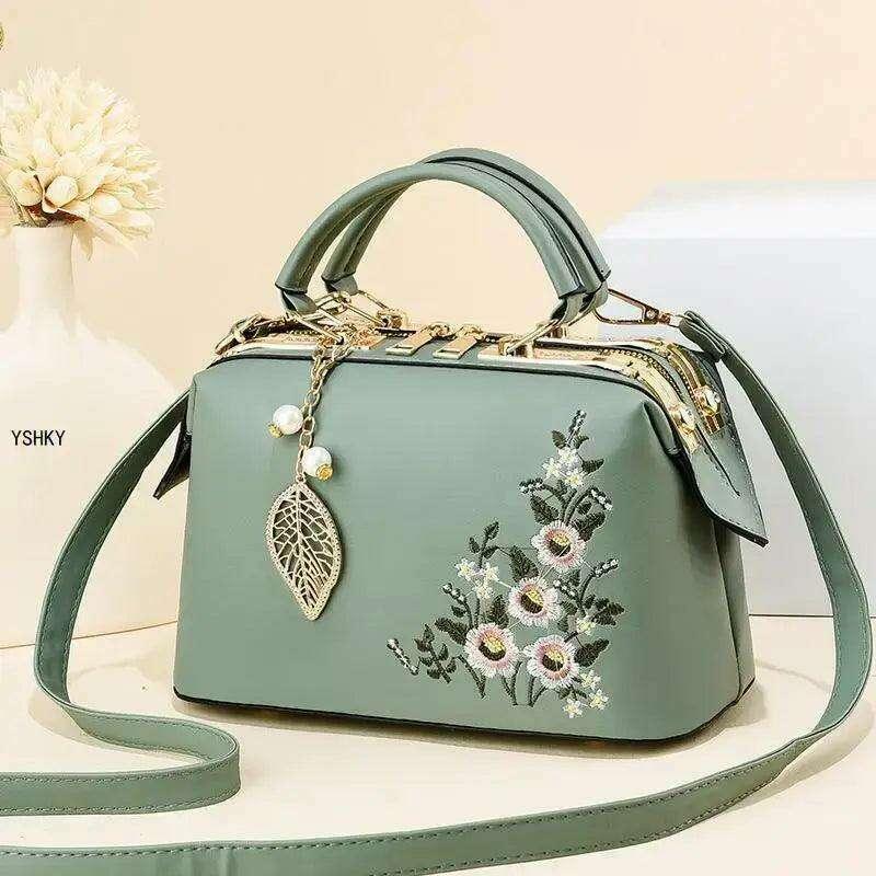 Elegant feminine bag with embroidered floral design