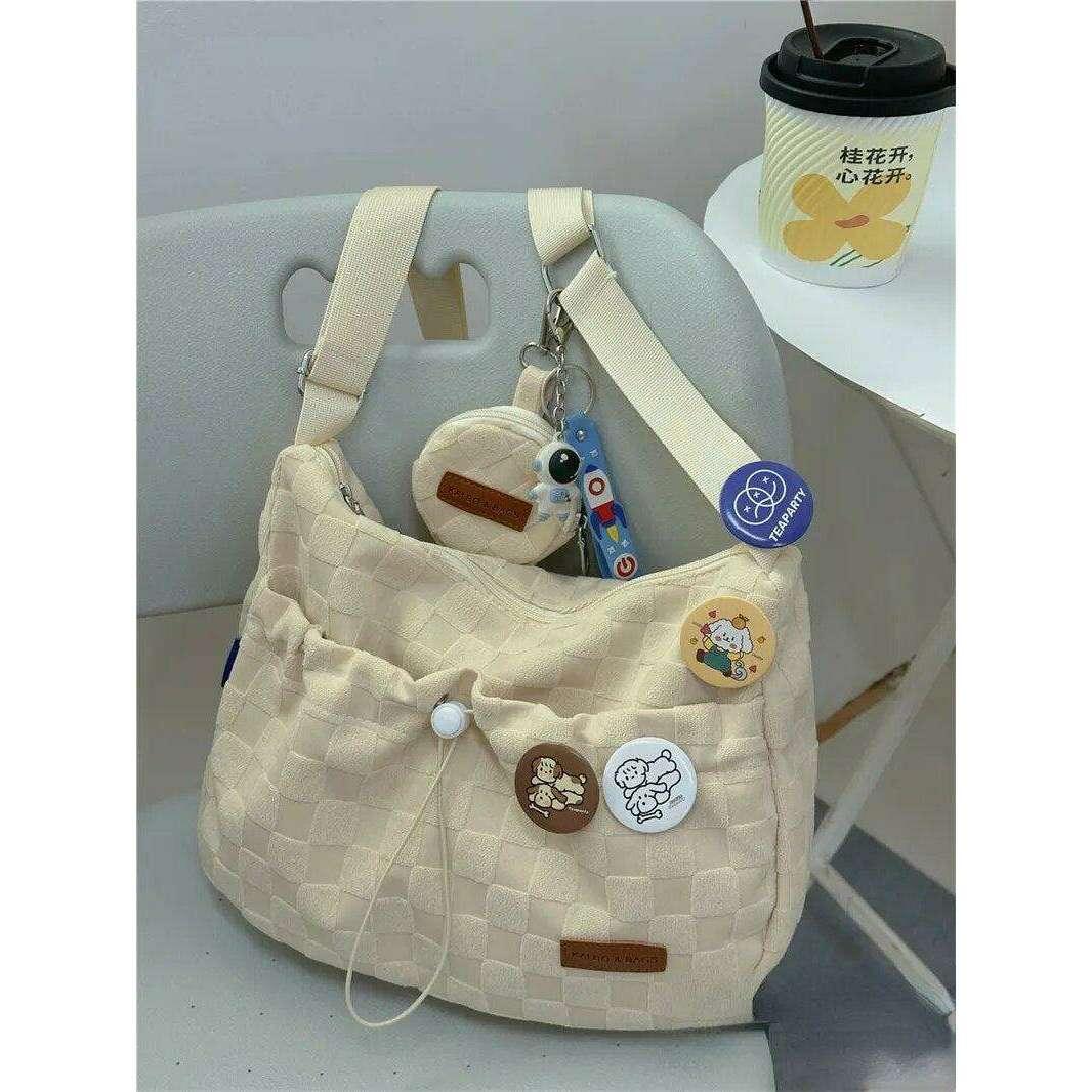 A padded fabric side bag in a modern design with cute details